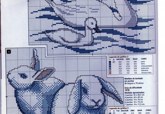 A pair of swans with baby