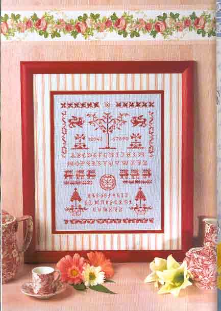 Red cross stitch sampler with various shapes and symbols (1)