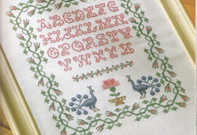 Sampler embroidery with two peacocks and an alphabet (2)