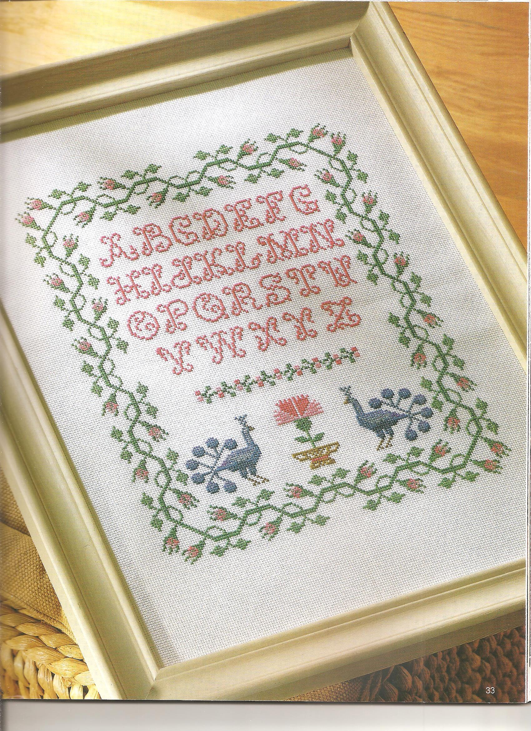 Sampler embroidery with two peacocks and an alphabet (2)